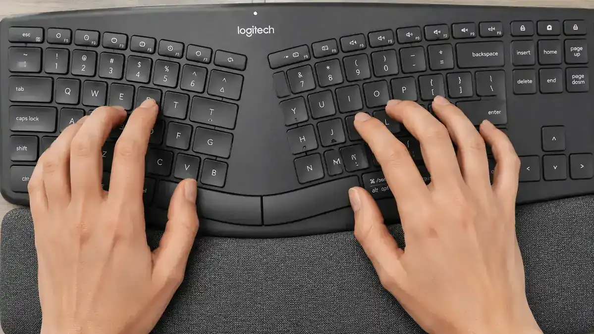 The K860 USB Logi Bolt receiver plugged into a laptop USB-A port beside a hub adapter showing the port chain